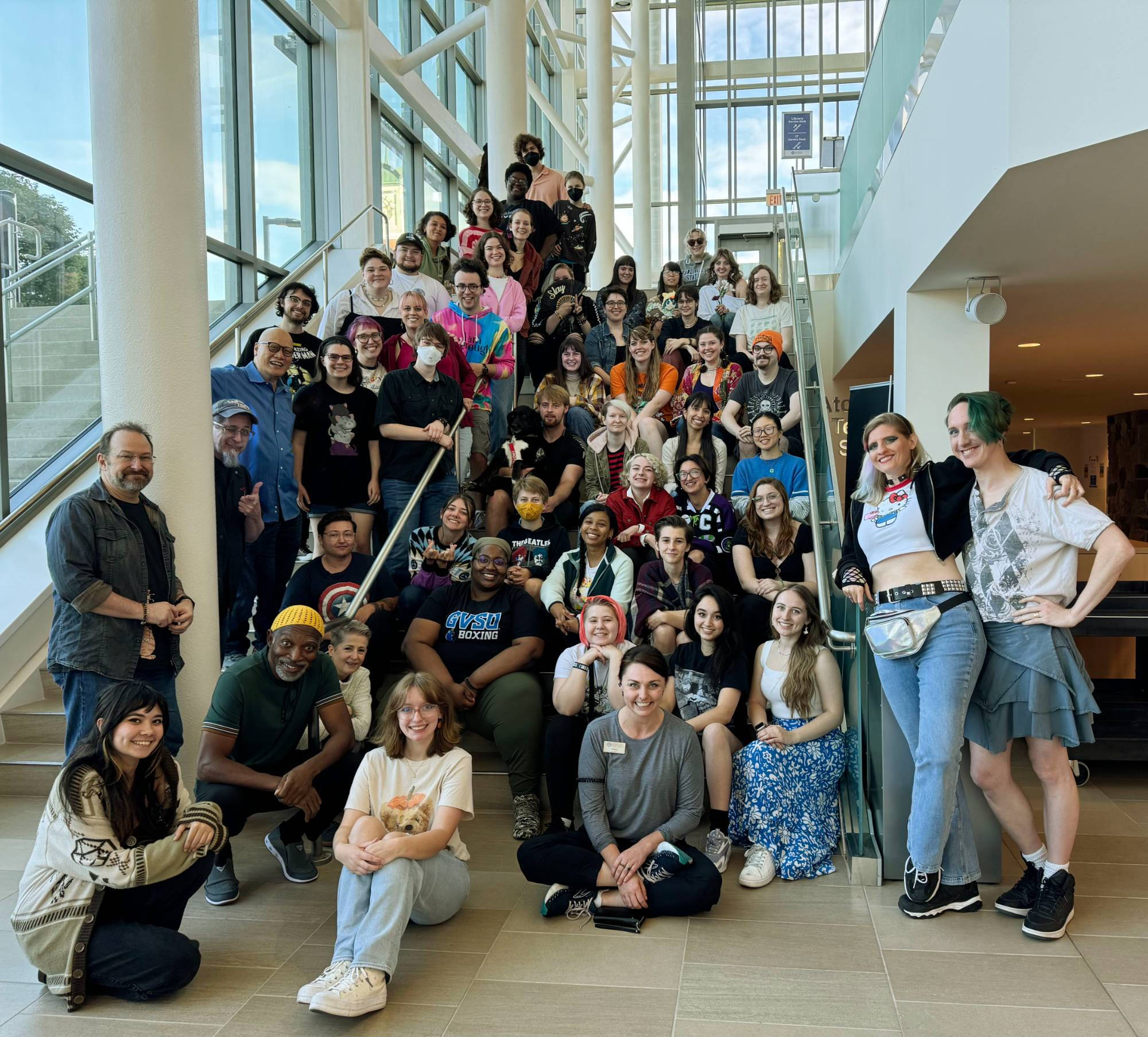 LakerCon attendees standing on a staircase